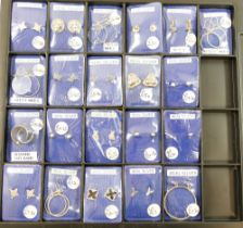 Twelve pairs of silver and silver coloured metal earrings including studs, hoops and clip-ons. Ex-