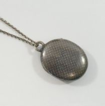 A 19th century oval niello locket on chain, the locket 2.5cm wide CONDITION REPORTS & PAYMENT