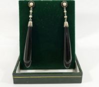A pair of split pearl and onyx drop earrings, with stick backs, 6cm long, and a turquoise set cross,