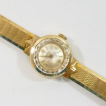 A 9 carat gold ladies Enicar wrist watch and strap, the circular face with Arabic numerals and baton