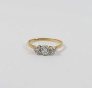 A diamond three stone ring, the old-cut centre stone approximately 0.38 carats, the outer old-cut