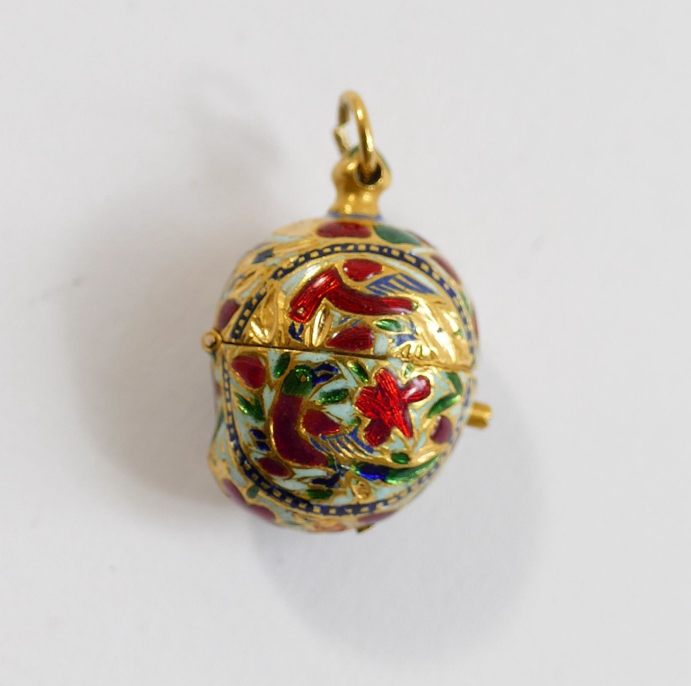 An Indian gold and enamel ovoid pendant, with hinged top, decorated in champleve enamel in white red - Image 2 of 4