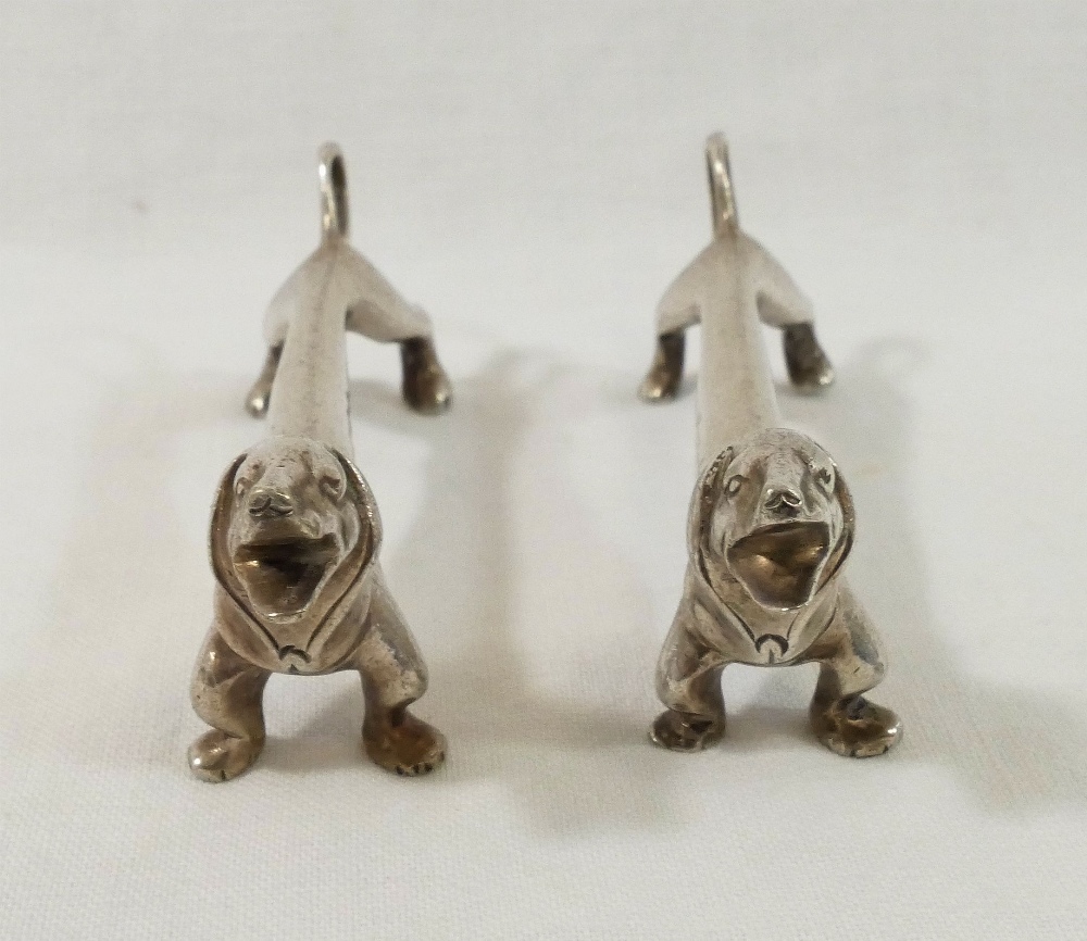 A pair of silver plated knife rests modelled as Dachshunds, unmarked, 7.8cm long CONDITION REPORTS & - Image 2 of 2