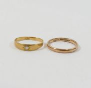 A 9 carat gold wedding band, Birmingham 1922, finger size P, 2.2g, and a diamond set gypsy ring, the