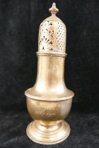 A large early 20th century silver sugar sifter, London 1910, of typical baluster form, raised on