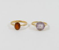 A 22 carat gold citrine set single stone ring, Birmingham 1885, finger size P, 2.6g gross, and an