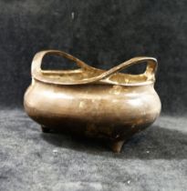 A Chinese Xuande-style bronze two-handled censor/incense burner, raised on three legs  with 16
