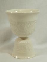 A Wedgwood Barlaston double eggcup, decorated with impressed scrolling foliate design, 10.5cm high