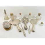 Assorted silver dressing table items comprised of three silver-backed hand mirrors, a silver