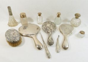 Assorted silver dressing table items comprised of three silver-backed hand mirrors, a silver
