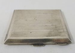 A silver cigarette case, Birmingham 1924, with engine turned decoration and gilt interior, 8.2cm x