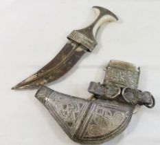 A 20th century Omani ceremonial Khanjar jambiya, the white plastic handle with silver coloured metal