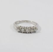 An 18 carat white gold diamond five stone ring, the round brilliant cut stones each approximately