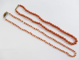 A Victorian child's coral bead necklace, with gold barrel clasp, 35cm long, another child's coral