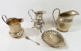 Three small silver cream jugs, comprised of a Georgian style jug, London 1932, 10.8cm high, a