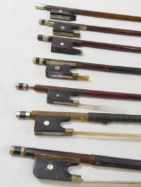 Seven 19th century and later violin bows, in various states of repair, where present with ivorine,