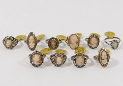 Ten carved shell cameo rings, eight with silver hallmarks and two stamped 'SILVER', and four shell