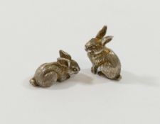A silver rabbit brooch, Sheffield 1989, 2.5cm long, two miniature silver rabbits, London 1984, one