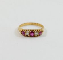 A late Victorian 18 carat gold ruby and diamond five stone ring, Birmingham 1898, the three round