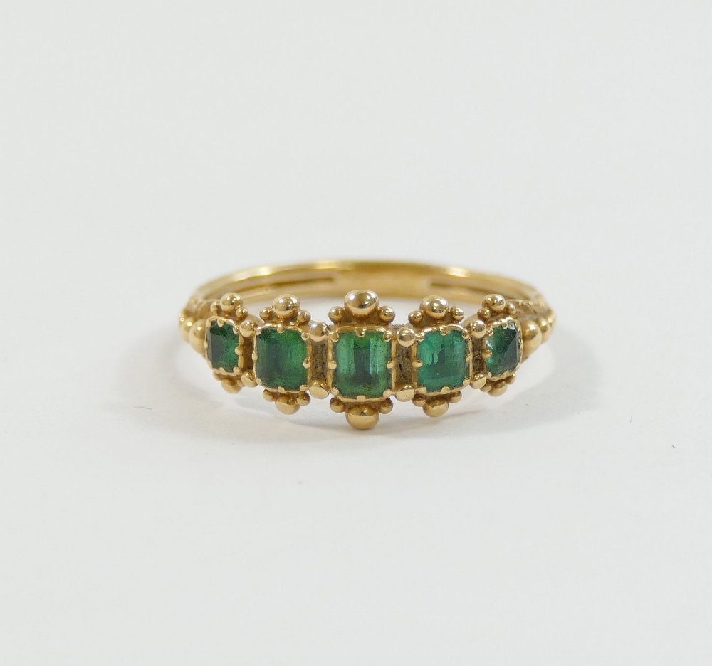 A Georgian gold and emerald five stone ring, the graduated emerald-cut stones in individual closed