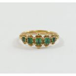 A Georgian gold and emerald five stone ring, the graduated emerald-cut stones in individual closed