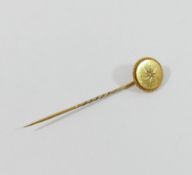 A 19th century 18 carat gold stick pin, the single rose cut diamond in gypsy setting, the head of