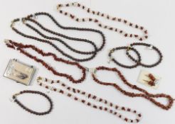 An assortment of jasper, goldstone and ironstone beaded jewellery comprised of a jasper pebble