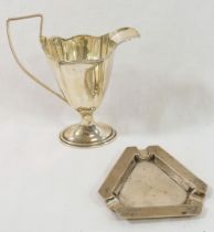A silver cream jug of Neoclassical design Birmingham 1911, 13.5cm high, and an Art Deco silver ash