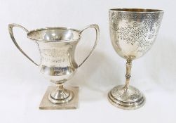 A Victorian silver chalice, London 1882, with engraved design and crest of a horses head above a