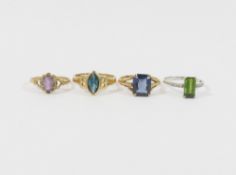 Three 9 carat gold single stone rings, and another stamped '9ct' including a green tourmaline ring