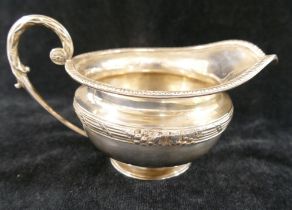 A George V silver two-handled sugar bowl and matching jug, London 1912, by the Goldsmiths and