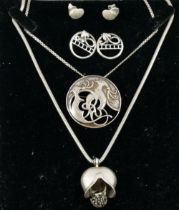 A circular silver Celtic pendant brooch by Ola Gorie, Edinburgh 1988, 3.6cm diameter, on a