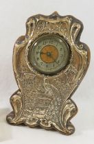 An Edwardian silver mounted clock, the circular face with Arabic numerals, made by the British
