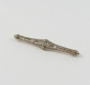 A late 19th/early 20th century Continental openwork brooch, centrally set with diamond,