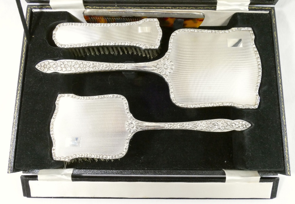 A silver backed dressing table set, comprised of a long handled hair brush, a smaller hair brush, - Image 2 of 4