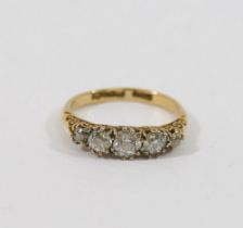 A diamond five stone carved half hoop ring, the graduated old-cut stones combined weight