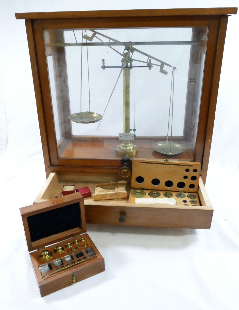 A set of early 20th century brass apothecary/precision scales, housed in glazed wooden case, with - Image 2 of 3