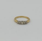 A 9 carat gold diamond five-stone ring, the five graduated round mixed cut diamonds combined