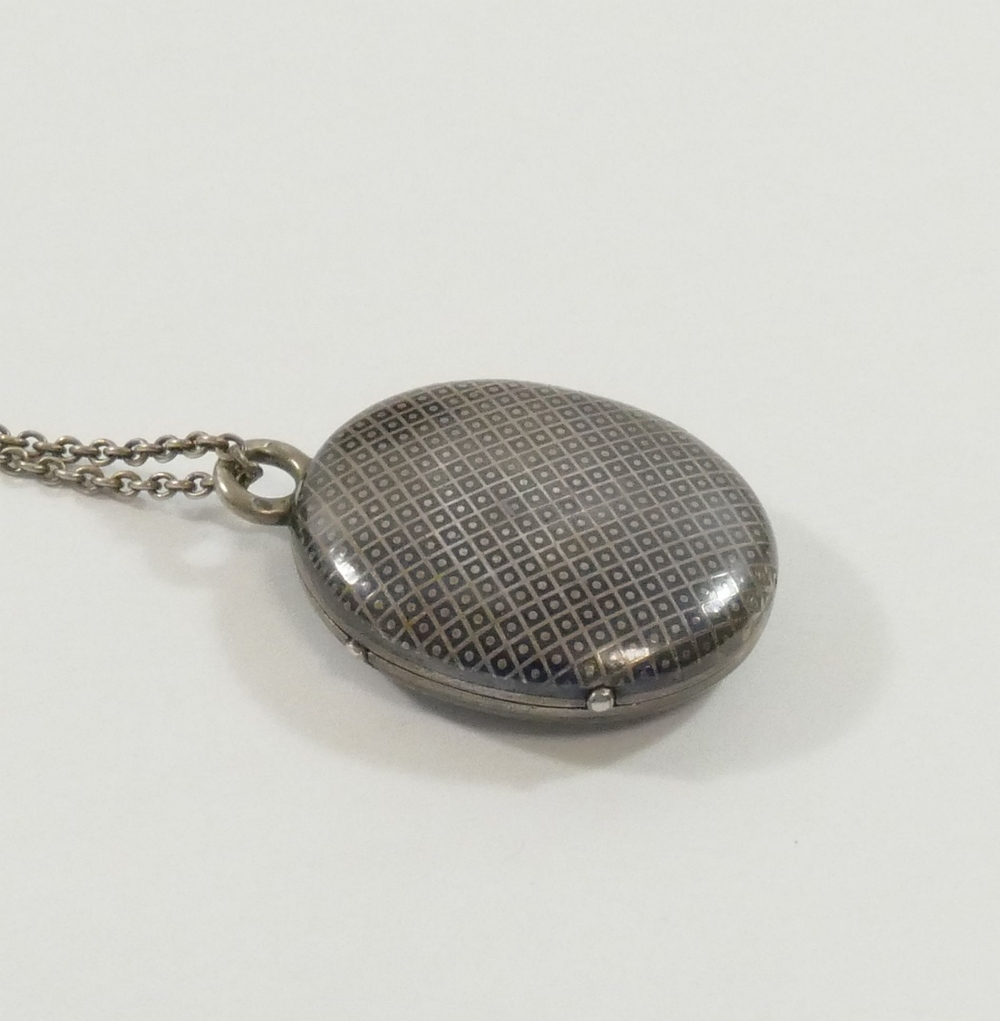 A 19th century oval niello locket on chain, the locket 2.5cm wide CONDITION REPORTS & PAYMENT - Image 2 of 3