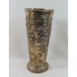 A large silver vase, of tapering cylindrical form with embossed decoration, London 1911, 26cm