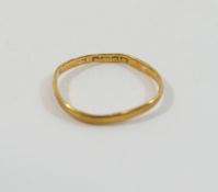 A 22 carat gold wedding band, Birmingham 1936, finger size L, slightly misshapen, 1g CONDITION