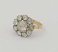 A 19th century rose-cut diamond daisy-head cluster ring, the rose cut stones in foil back setting,
