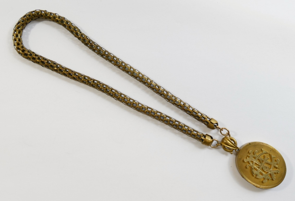 A Victorian oval gold plated locket with intertwined initials set in relief to the front, 3.3cm x - Image 2 of 9