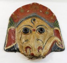 A Nepalese papier mache on fabric hand-painted mask of the elephant god Ganesha, 28.5cm x 36cm