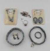 A quantity of hematite jewellery comprised of three bracelets, a beaded necklace, three pairs of