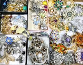 A large quantity of 20th century costume jewellery including a Trifari gold plated bow brooch,
