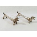 A pair of silver plated knife rests modelled as Dachshunds, unmarked, 7.8cm long CONDITION REPORTS &
