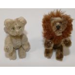 A miniature Steiff lion, 9.5cm long, and a faded miniature Steiff tiger, 9cm long, tail lacking