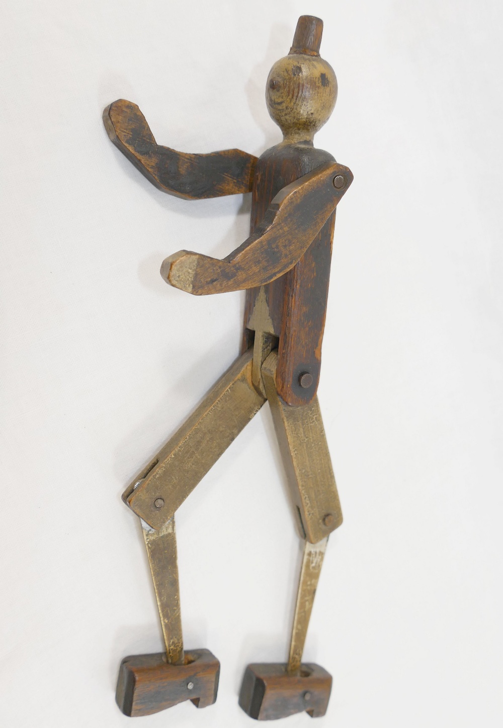 A  scratch built wooden Pinocchio puppet, with hinged arms, legs and feet, 26cm long, with broken - Image 5 of 5