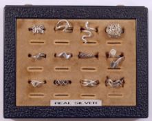 Twelve assorted silver and silver coloured metal rings, all either hallmarked or stamped '925' or '